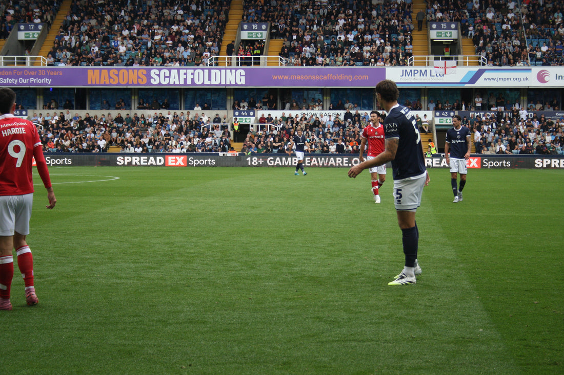 Wrexham AFC players and a packed away end against Millwall, 30 August 2025