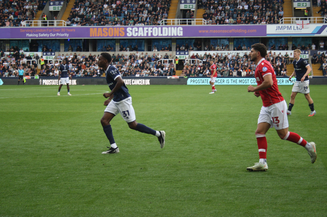 Wrexham AFC player in action against Millwall, 30 August 2025