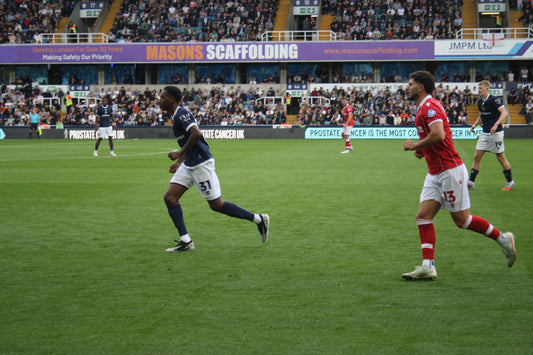 Wrexham AFC player in action against Millwall, 30 August 2025