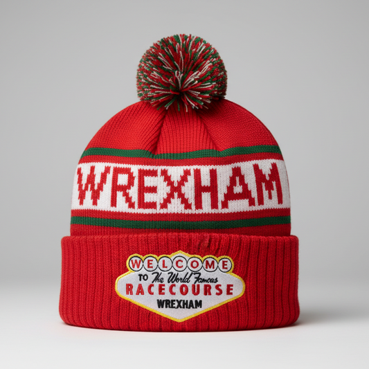 Red beanie with pom-pom and 'Wrexham' text on a gray background