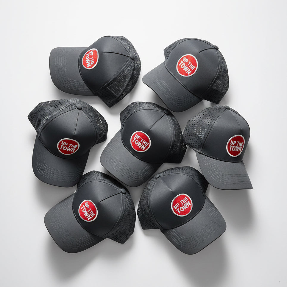 Great baseball caps with red and white 'Up The Town' logo.